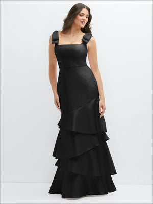 Bow-shoulder satin maxi dress in black with asymmetrical tiered skirt, front view