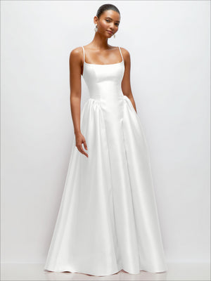 Ivory satin maxi dress with scoop neckline, spaghetti straps, and gently pleated skirt