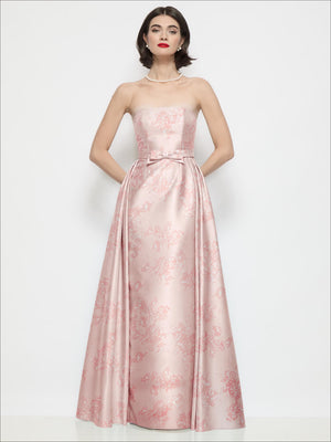 Pink floral strapless satin column dress with bow at waist and full skirt