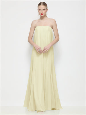 Light yellow strapless shirred chiffon maxi dress with flowing trapeze skirt