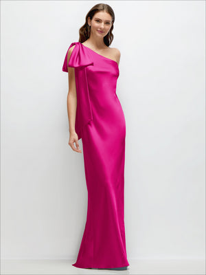 One-shoulder satin maxi dress in fuchsia pink with cascading shoulder bow and side slit