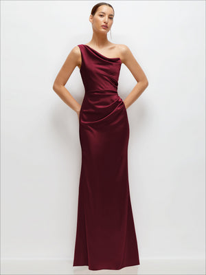 Burgundy one-shoulder satin maxi dress with cat-eye neckline, fitted waist and flared skirt