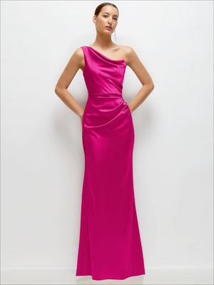 Fuchsia one-shoulder satin maxi dress with cat-eye neckline, fitted waist and flowing flare