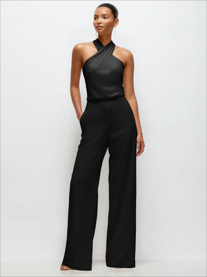 Black sleeveless halter crepe jumpsuit with wide-leg pants and smooth draped front