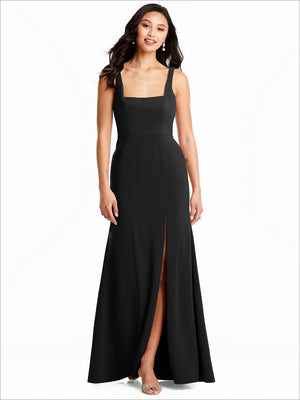 Floor-length black bridesmaid dress with square neckline, thin straps, and side slit.