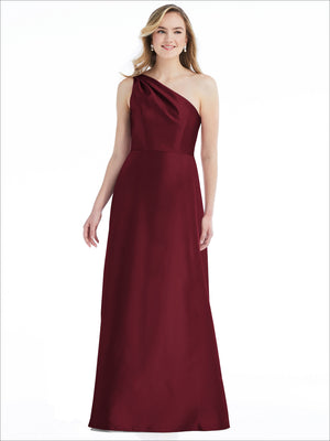 Burgundy one-shoulder satin maxi dress with draped bodice and pleated flowing skirt
