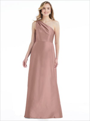 Blush one-shoulder satin maxi dress with draped pleats and side pockets.