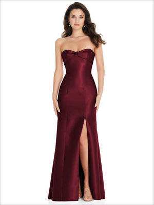 Deep burgundy strapless satin trumpet gown with bow detail and front slit
