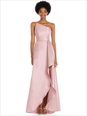 One-shoulder satin gown in pale blush pink with draped front slit and long skirt