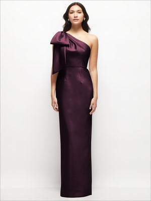 Deep plum one-shoulder satin column maxi dress with oversized bow at shoulder
