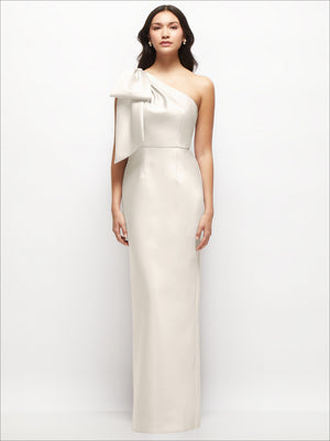 Ivory one-shoulder satin column maxi dress with oversized bow drape on the shoulder