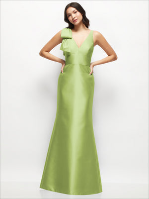 Lime green satin trumpet dress with one-shoulder cascading bow and deep V-neck