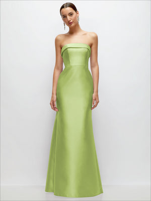 Light green satin strapless trumpet gown with structured straight bodice and flared skirt.