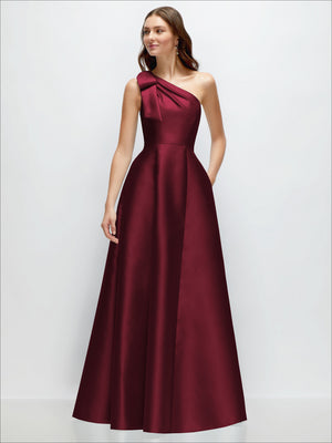Burgundy satin one-shoulder maxi dress with bow detail and full A-line skirt