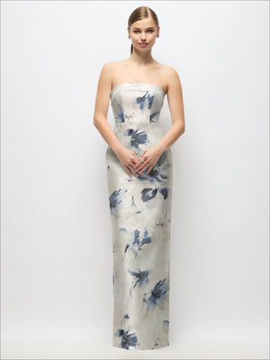 Ivory strapless satin maxi dress with blue floral splash print, fitted column silhouette.