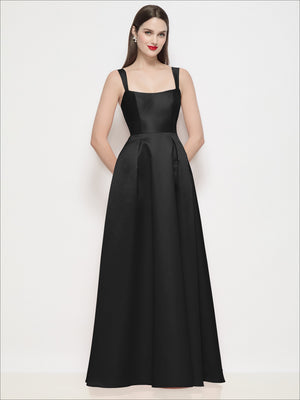Black satin maxi dress with shaped straps, square neckline, and pleated skirt