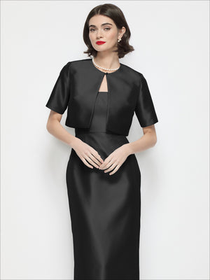 Black satin cropped jacket with jewel neckline and short sleeves, cropped waist length