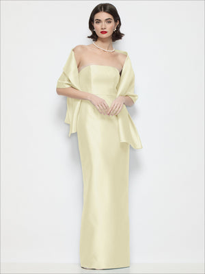 Satin wrap stole in pale yellow satin, draped over shoulders with ribbon ties.