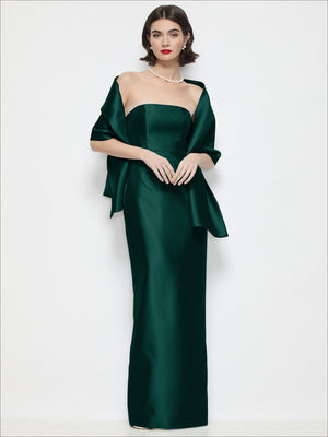 Green satin wrap stole draped over shoulders, showing ribbon ties at the front.