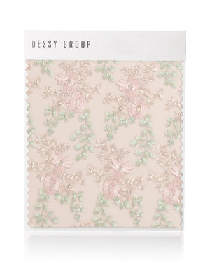 Floral embroidery swatch with pastel flower and leaf designs on blush pink background